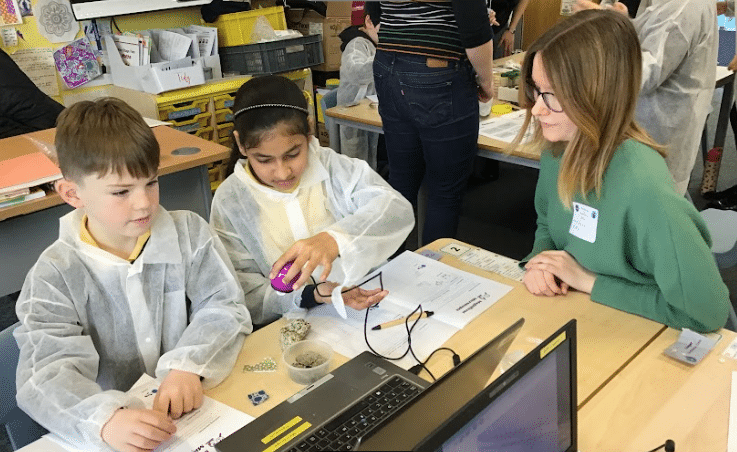 Using zoomy microscopes during a science, art and writing workshop at Drake primary school to look at leaf ctter ants